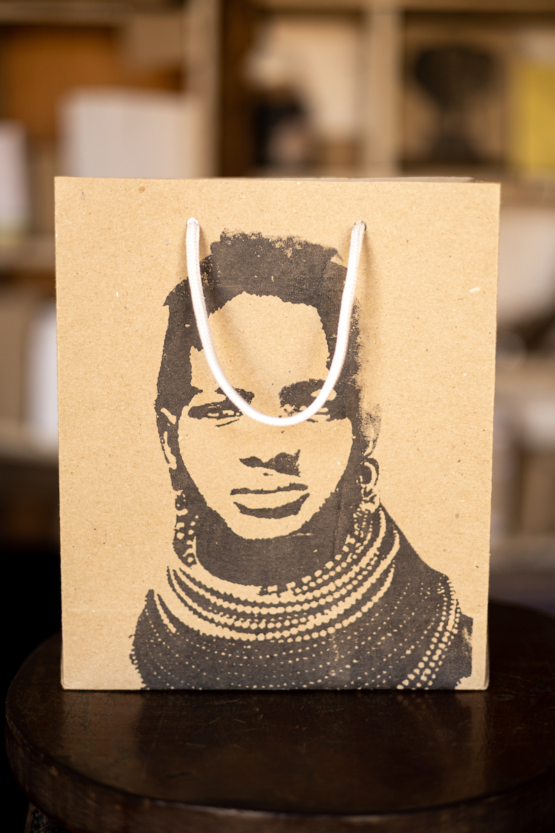 side view of khaki gift bag with beautiful portrait